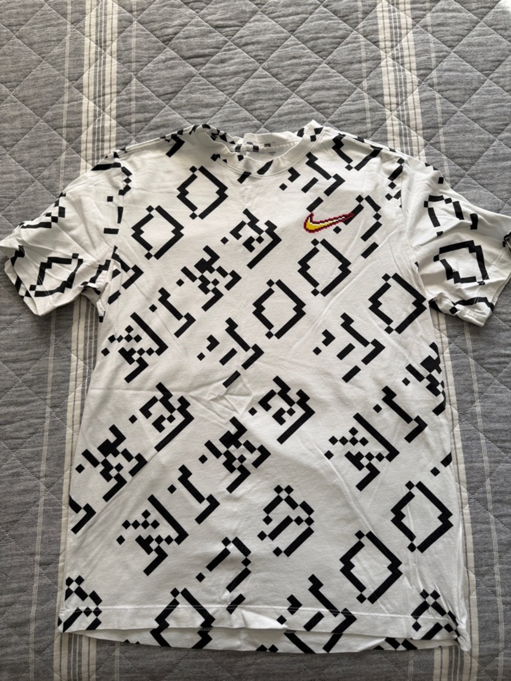 Nike White Short-Sleeve Pixel Pattern Tee with Red/Gold Swoosh